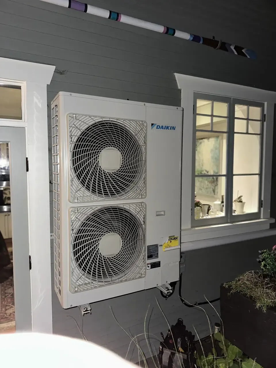 Daikin heat pump mounted clear of the wall by Pro West