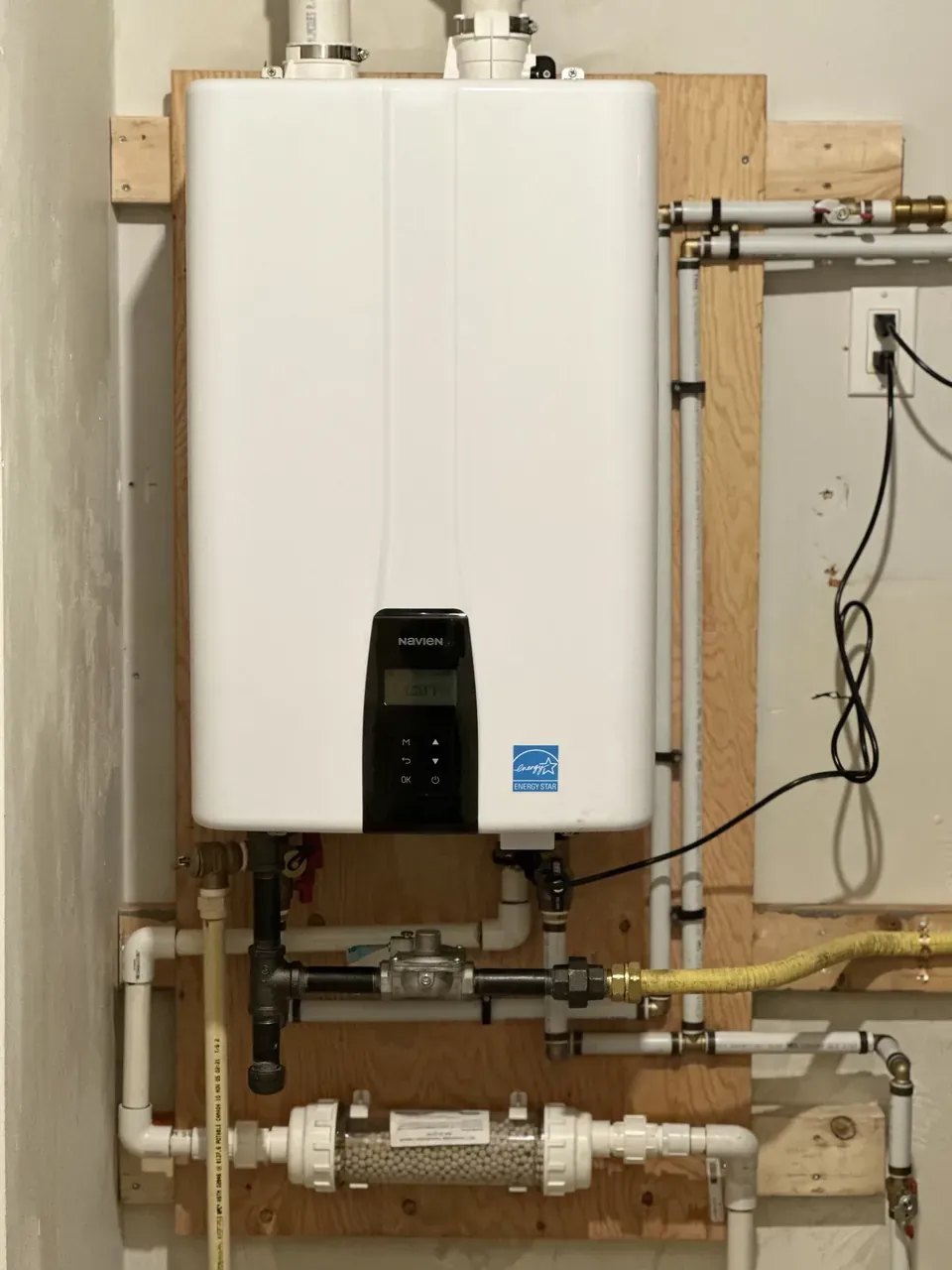Navien tankless water heater installed by Pro West with tidy, serviceable piping